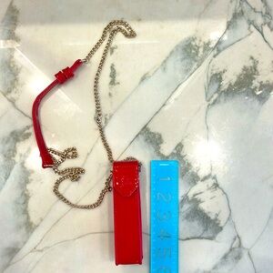 Christian Louboutin perfume or lipstick bag